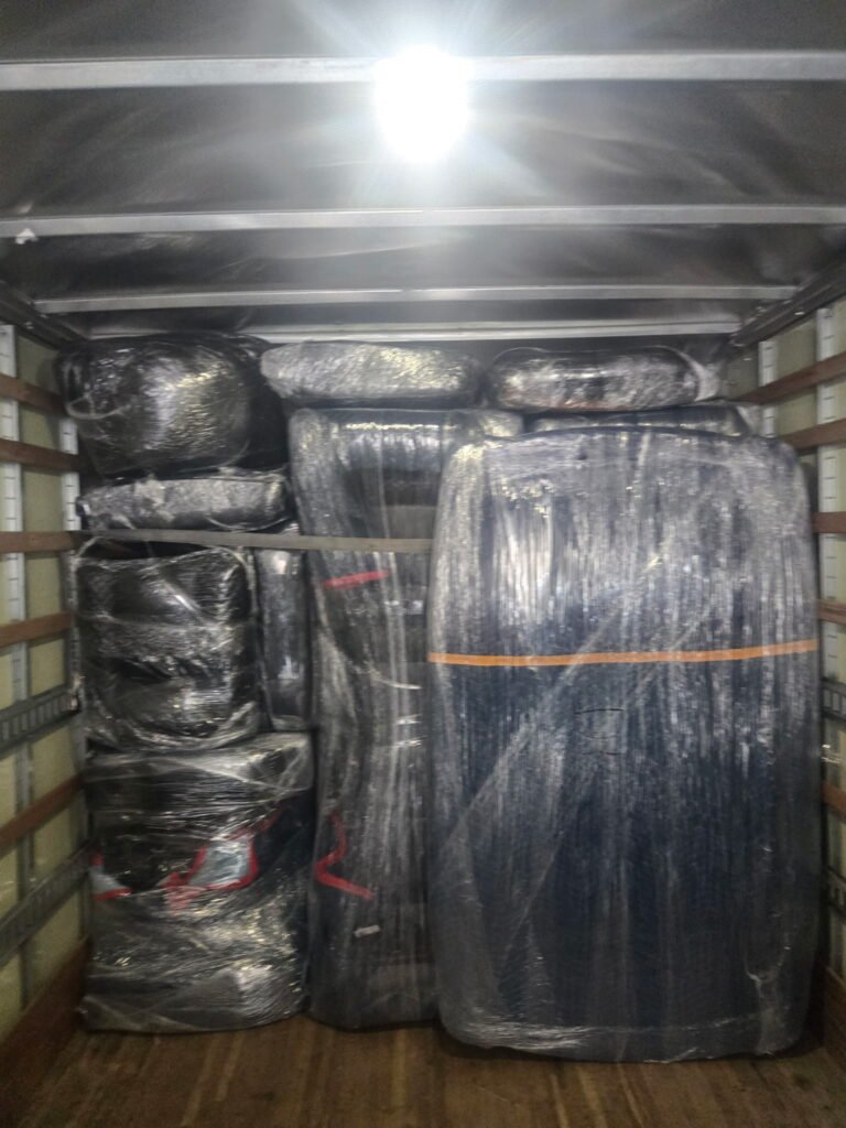 Professional movers transporting furniture with care