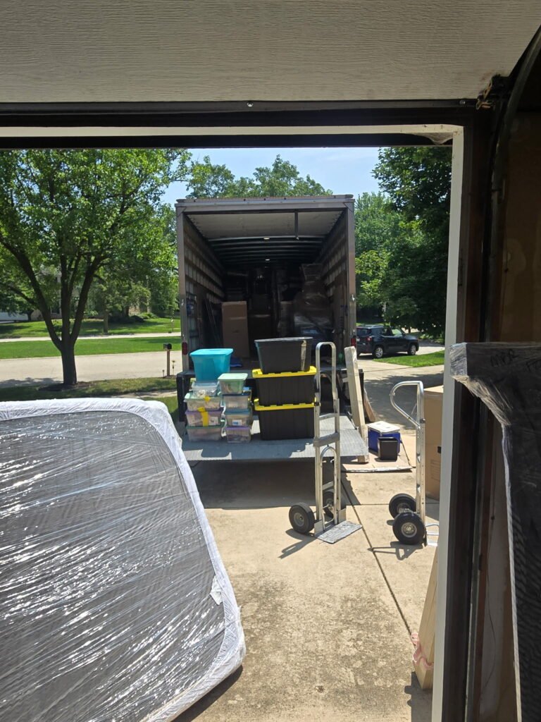 Experienced Chicago movers handling truck loading with care